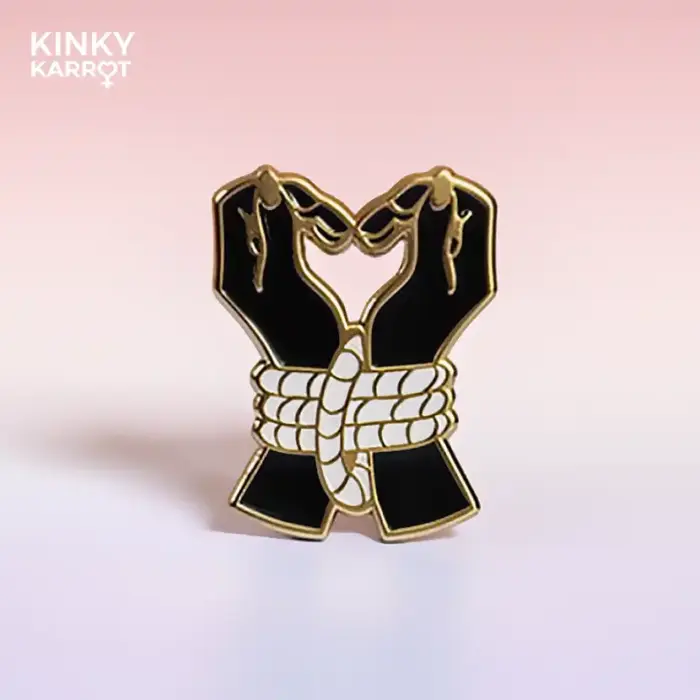 feminist symbol enamel pin with heart-shaped venus design in pink
