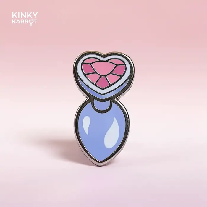 butt plug enamel pin with pink heart gem and lilac base