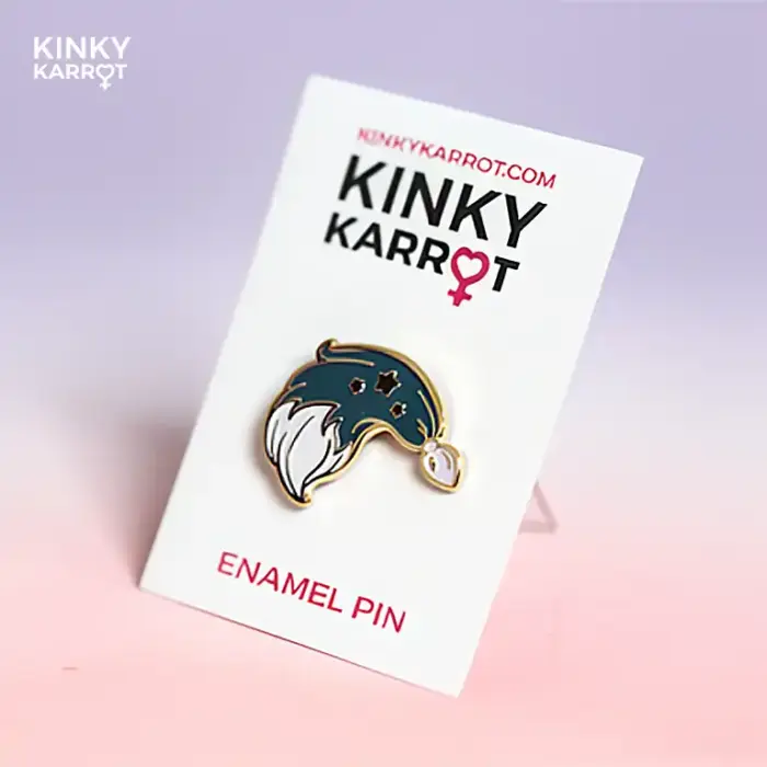 Black fox tail butt plug enamel pin with silver stars on a soft gradient background