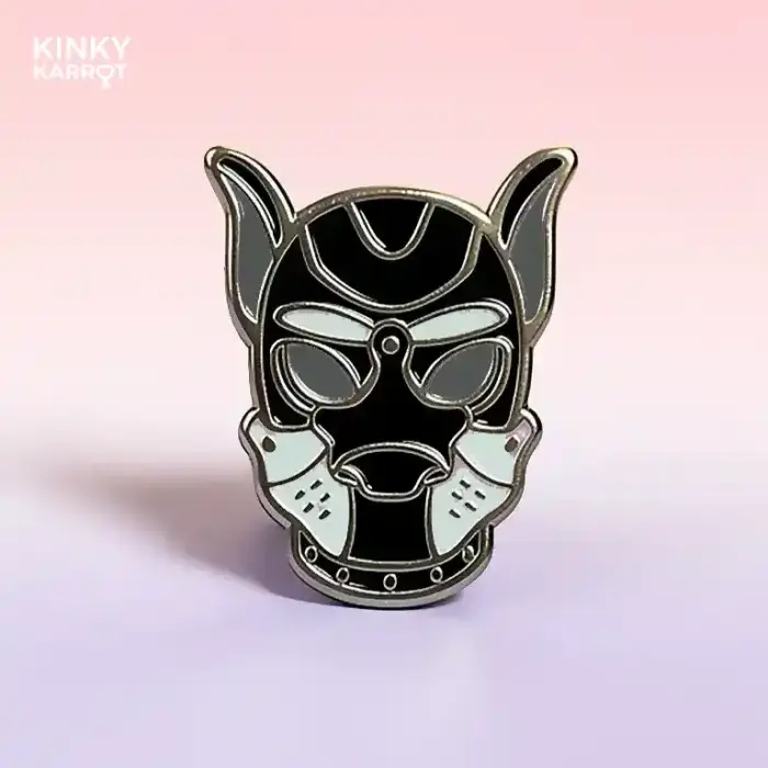 puppy play mask enamel pin in grey with black accents on gradient background