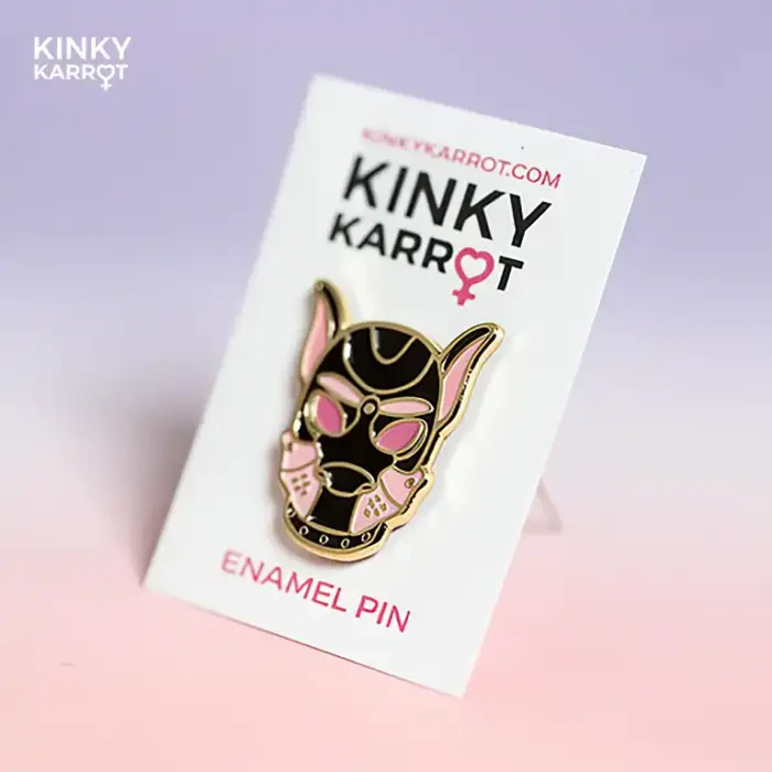 puppy play enamel pin in pink on Kinky Karrot backing card