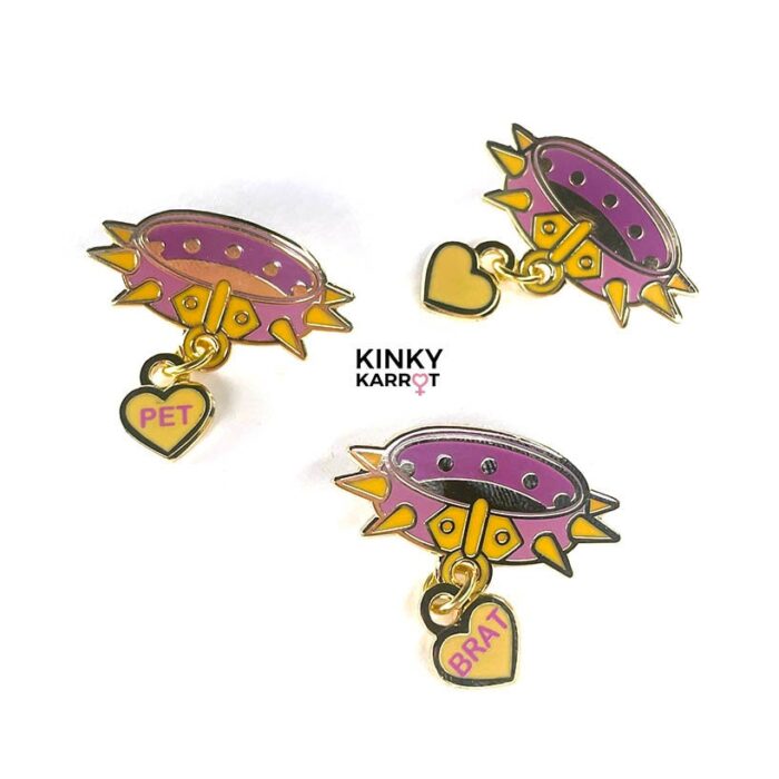 Set of three pink spiked collar enamel pins with BRAT, PET, and blank heart charms