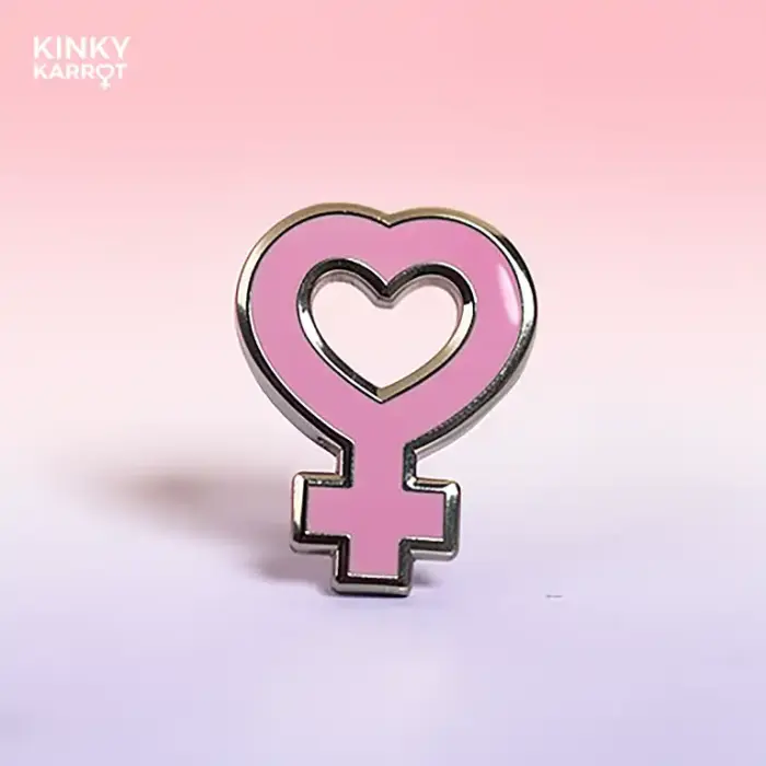 feminist symbol enamel pin with heart-shaped venus design in pink