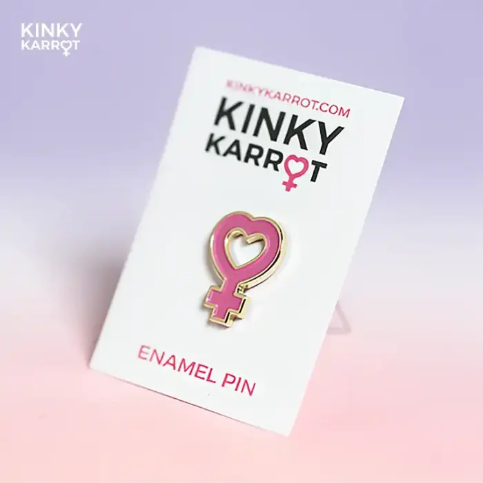 feminist symbol enamel pin with heart-shaped venus design in pink